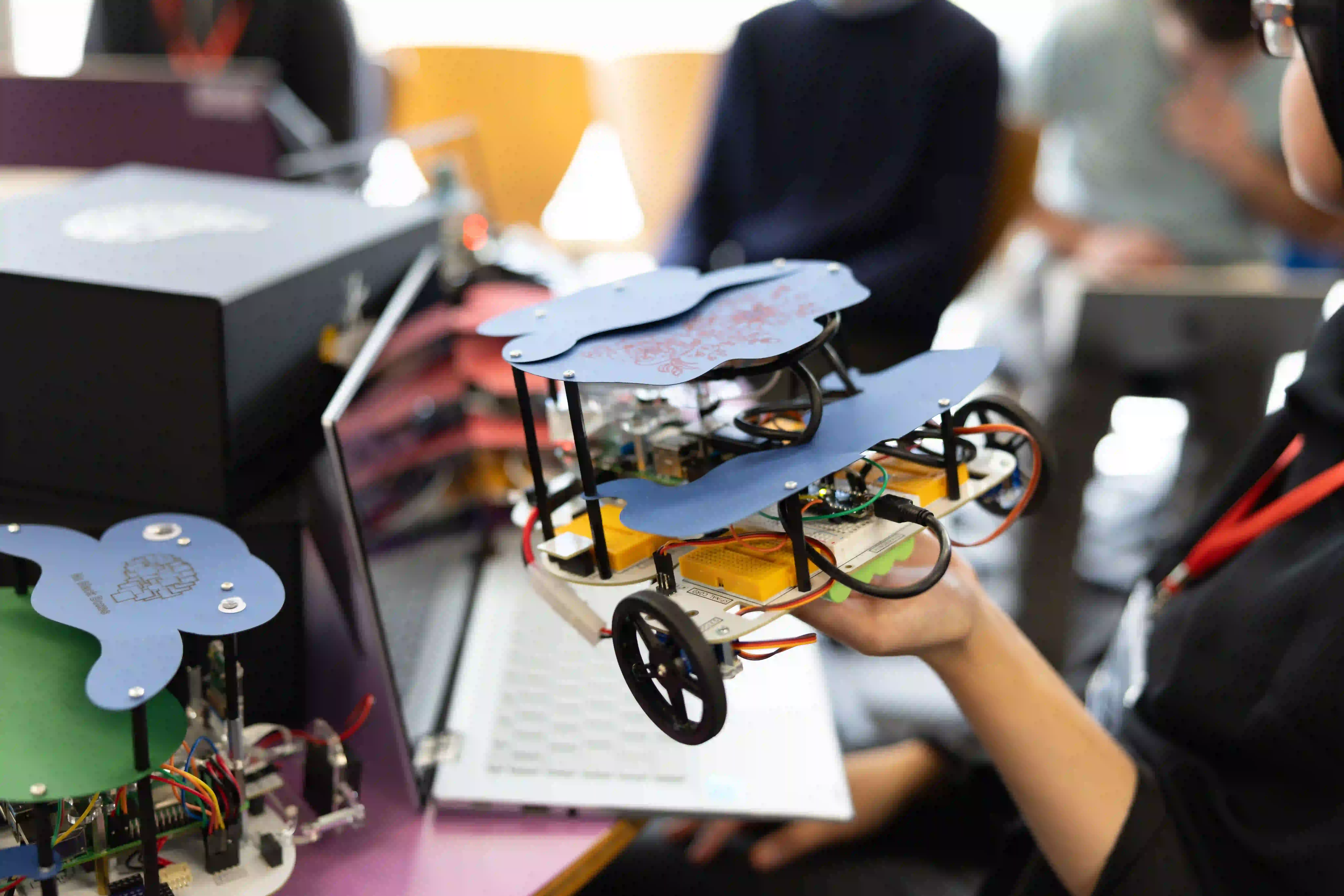 Build a Brain students with robots